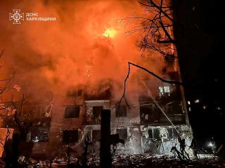Firefighters work at the site of the apartment building hit by a Russian missile strike, amid Russia's attack on Ukraine, in the town of Balakliia, Kharkiv region